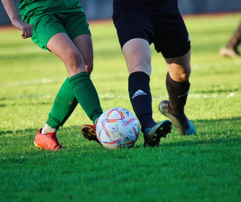 Photo showing two soccer players competing for the ball