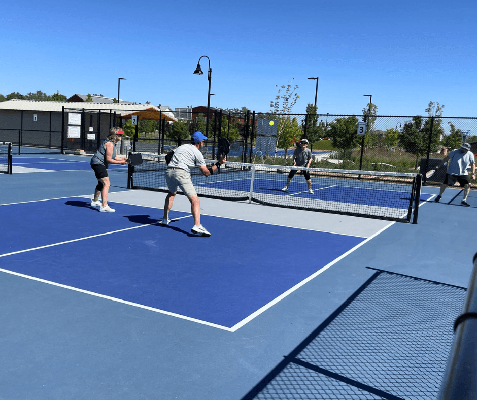 Photo of of a 2v2 pickleball match at the Waggener Farm Park pickleball courts