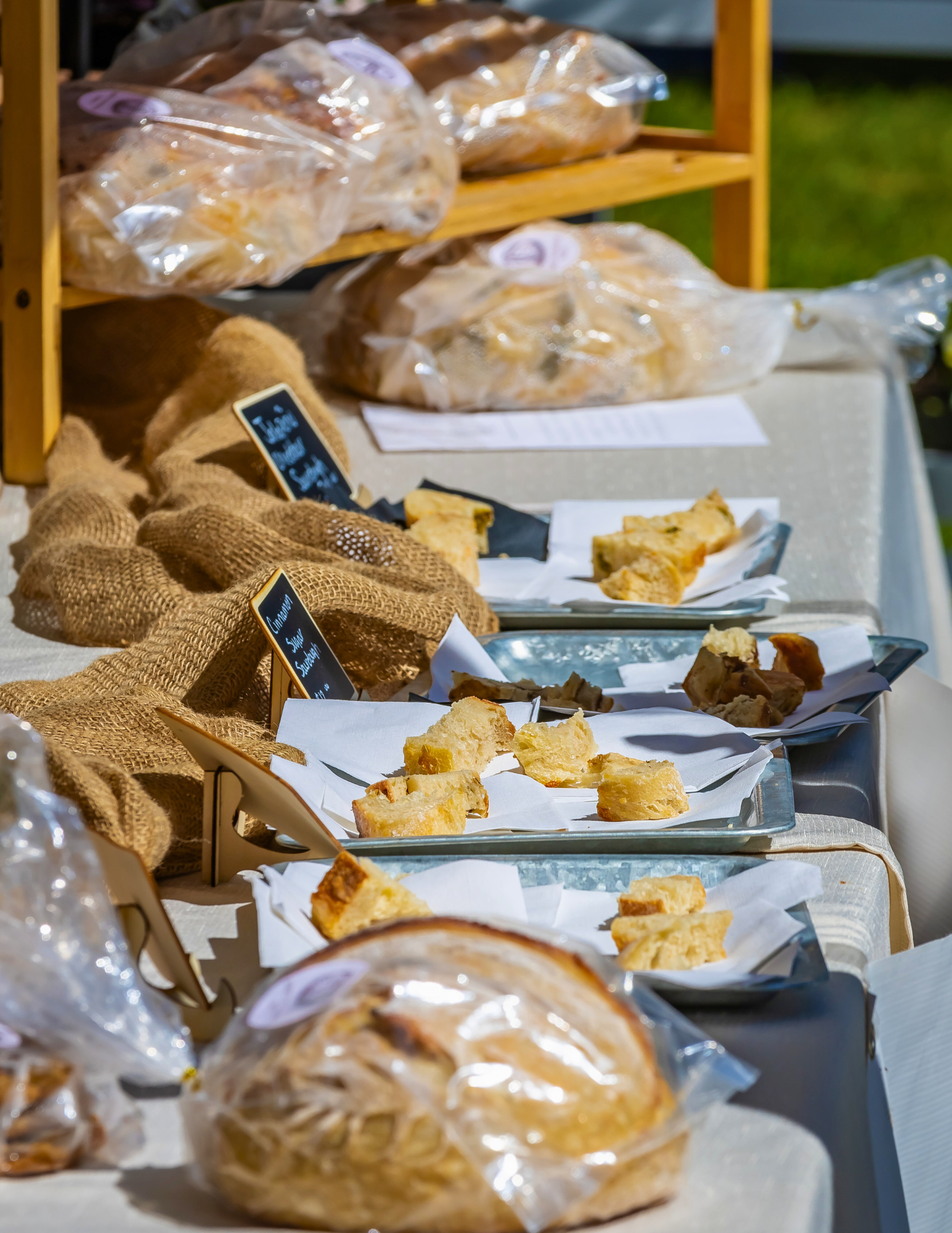 Freshly baked breads displayed at a vendor booth at the Berthoud Market.