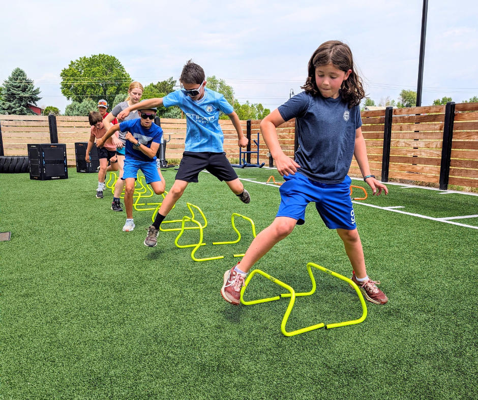 Teenagers performing hurdle drills during Speed Agility and Quickness Camp