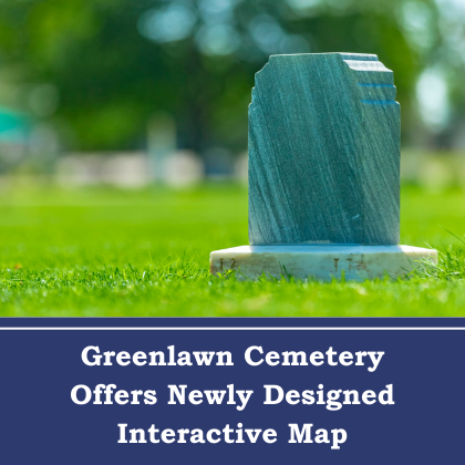 Headstone in grassy cemetery